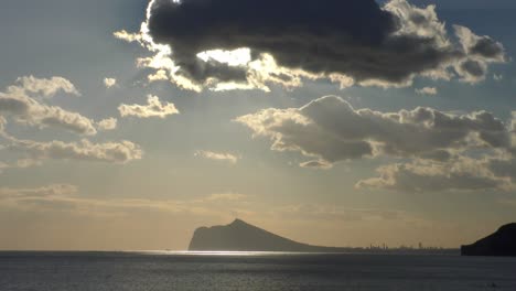 Calpe-Spain-impressive-clouds-and-late-evening-winter-sunshine-with-the-skyline-of-Benidorm