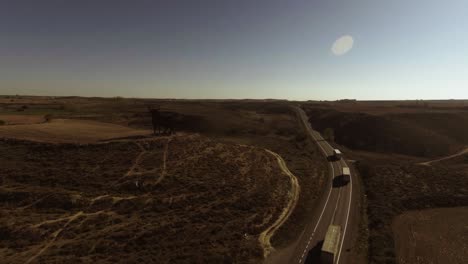 Aerial-shot-of-highway-in-Spain,-cars-and-trucks-driving-by
