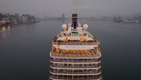 Drone-lifting-shot-of-cruise-ship-Mein-Schiff-5-arriving-in-Hong-Kong-in-morning-dawn