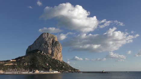 Calpe-Spain-Pena-De-Ifac-in-late-evening-winter-sunshine-with-the-Marina-and-Fishing-harbour