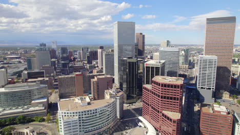 Drone-view-of-Downtown-Denver-near-civic-center-park-and-capitol-hill-during-fall-on-sunny-day---Denver,-Colorado,-USA