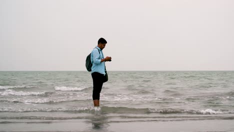 Photographer-taking-picture-at-sea-shore-in-Kuakata,-Bangladesh