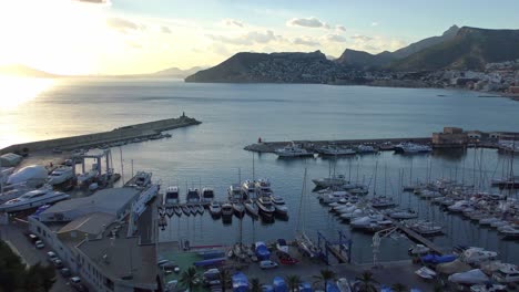 Calpe-Spain-view-of-the-marina-and-fishing-harbour-from-Pena-De-Ifac-on-a-bright-winter-evening