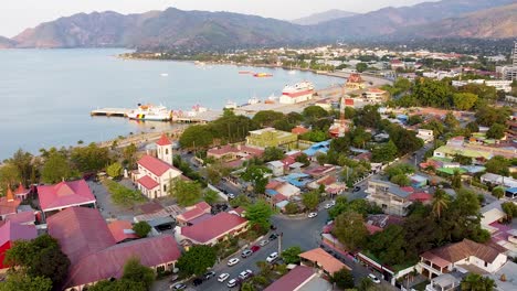 Aerial-drone-view-of-the-capital-city-of-Dili,-Timor-Leste-in-Southeast-Asia-with-residential-houses-surrounded-by-streets-and-trees