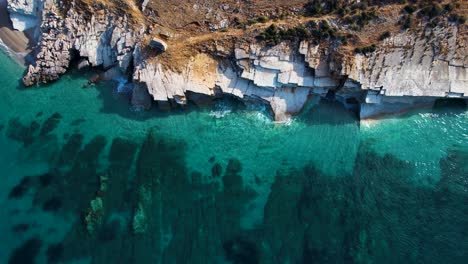 Unveiling-the-Hidden-Beauty-of-Lukova-Seashore:-Turquoise-Ionian-Sea-Embracing-White-Marble-Rocks-in-a-Summer-Paradise