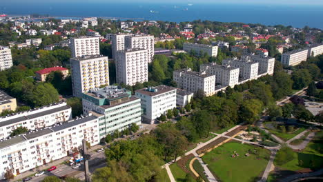 Aerial---Gdynia-city-center---building-of-the-Department-of-Oceanography-and-Geography-of-the-University-of-Gdańsk---buildings-near-the-central-park---in-the-distance-the-Bay-of-Gdańsk
