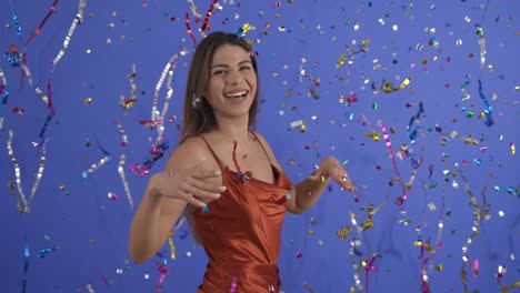 Party-time,-a-pretty-brunette-smiles-while-she-is-showered-with-streamers-and-confetti