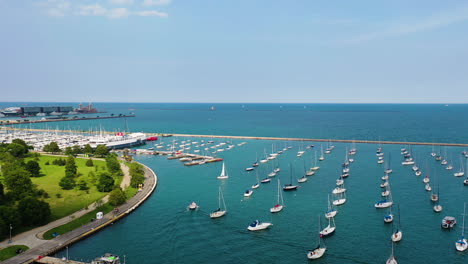 Aerial-view-of-boats-moored-at-the-Monroe-and-DuSable-Harbor,-summer-in-Chicago