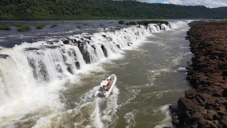 Aerial-View-Passing-over-Semirigid-Boat-Going-up-Against-the-Strong-Streams-of-Moconá-Waterfalls