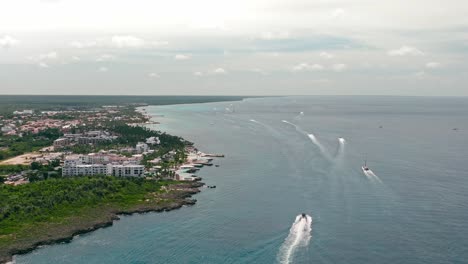 Boats-navigating-along-Bayahibe-coast,-La-Romana-in-Dominican-Republic
