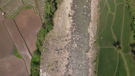 Overhead-drone-shot-of-big-rocky-rivers-are-starting-to-dry-up-due-to-the-dry-season