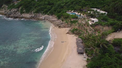 Aerial-capturing-picturesque-seascape-along-the-mesmerizing-coastline-in-Huatulco,-Mexico