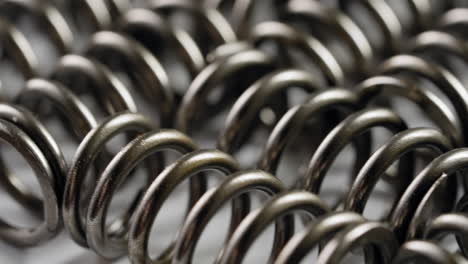 Detailed-Close-Up-of-Thick-Metal-Springs-in-Coil-Formation