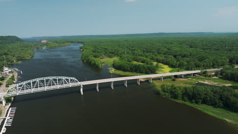 Panoramic-Aerial-Of-The-Wabasha–Nelson-Bridge-With-Dense-Forest-Trees-In-Wabasha,-Minnesota,-USA