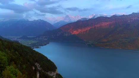 Interlaken-Switzerland-Aerial-Drone-Shot-Alps-Rugged-Mountians-Sunset-Push-In-Swiss-Countryside-Outback-Landscape