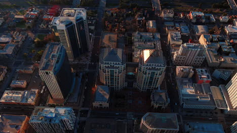 Downtown-Oakland-Skyscrapers-During-Golden-Hour,-Aerial-Cinematic-View