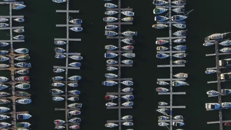 A-top-down-view-captures-the-marina-with-boats-moored-at-the-Whitby-Yacht-Sailing-Club-in-Ontario,-Canada