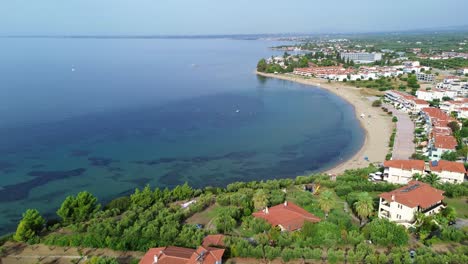 Daytime-drone-footage-of-Gerakini-Beach-in-Yerakini,-Halkidiki,-Greece,-providing-a-mesmerizing-4K-view