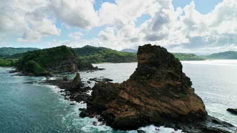 Rocky-stone-island,-coast-Nicaragua,-close-cinematic-drone-flight,-scenic-nature