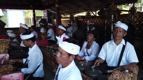 Balinese-People-Play-Gamelan-Gong-Kebyar-Ancient-Music-at-Hindu-Temple-Ceremony-in-Local-Gianyar-Village,-Indonesia