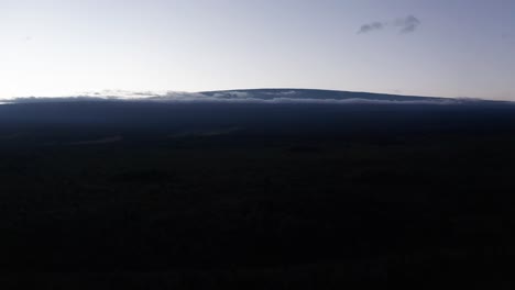 Wide-aerial-dolly-shot-of-the-volcano-Mauna-Loa-silhouetted-at-sunset-on-the-Big-Island-of-Hawai'i