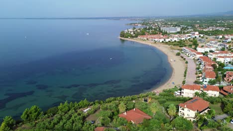 Behold-the-charm-of-Gerakini-Beach,-Yerakini,-Halkidiki,-Greece,-in-a-4K-drone-video-taken-during-daylight-hours