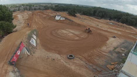 motocross-rider-executes-a-large-and-impressive-jump-on-a-dirt-track-in-motion