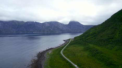Flying-over-the-scenic-route-in-Senja-with-the-view-to-segla-covered-in-clouds