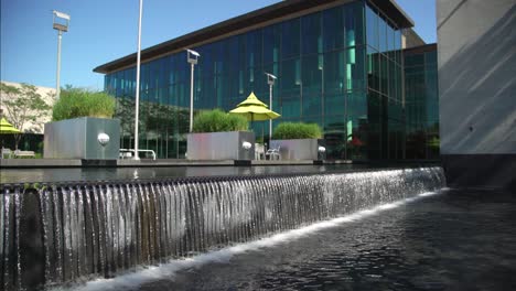 Modern-Architecture-with-Waterfall-Over-a-Stone-Wall-into-a-Pool-of-Water-at-Whitby-Public-Library-in-Canada
