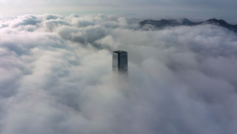 Low-clouds-and-fog-moving-around-the-ICC-skyscraper