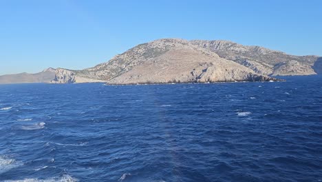 Passing-by-an-island-in-the-Aegean-sea,-Greece