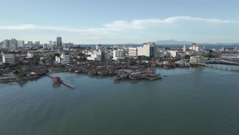 Aerial-view:-Warehouses-on-stilts-on-waterfront-of-Malaysian-city