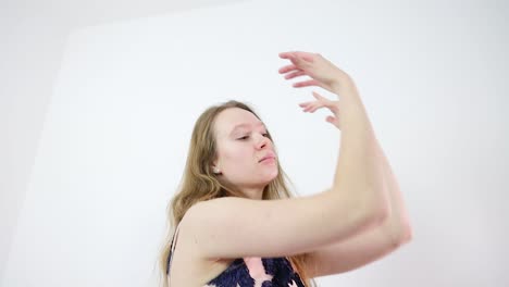 Slow-Motion-Dance-Performance-by-an-Attractive-Young-Caucasian-Dancer-in-a-White-Room