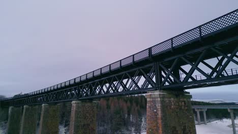 looking-over-Findhorn-Viaduct-towards-forest-and-winter-landscape-with-Icy-river