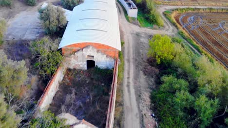 Drone-shot-of-old-abandoned-farming-house