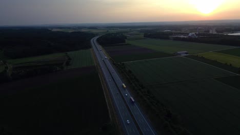 Vehicles-travelling-along-a-highway-on-the-outskirts-of-Bubesheim,-Germany