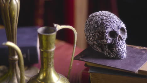 Dark-Elegance:-Renaissance-Inspired-Setting-with-Skull,-Books,-and-a-Gilded-Cup