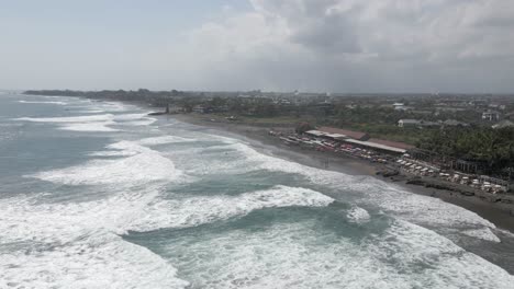 Frothy-Indian-Ocean-waves-wash-onto-shore-at-Megada-Beach-on-Bali