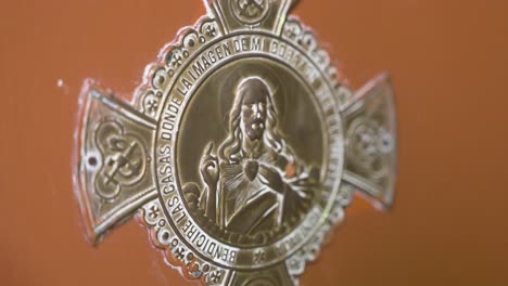 Image-of-a-Jesus-Christ-insignia-decorating-a-home's-door-to-welcoming-guests