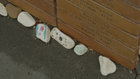 High-angle-view-of-decorated-commerative-pebbles-at-National-Holocaust-Names-Memorial-in-Amsterdam,-the-Netherlands