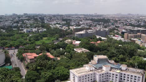 Daytime-in-4K-Aerial-footage-of-Hill-Top-Colony,-Banjara-Hills,-and-Khairtabad,-India's-urban-residential-and-commercial-centres-in-Hyderabad,-Telangana