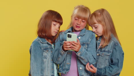 Three-cute-girls-friends-use-smartphone-surprised-by-bad-news,-fortune-loss,-fail,-lottery-results