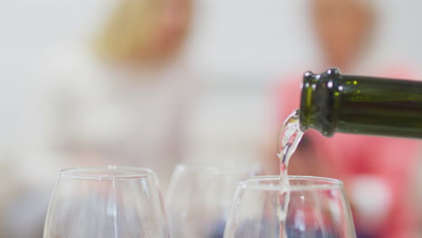 Close-Up-Of-Champagne-Or-Prosecco-Being-Poured-Into-Glasses-In-Celebration