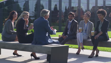 Multi-Cultural-Business-Team-Sitting-Outside-Office-For-Coffee-Break-Have-Informal-Meeting