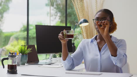 Woman-Working-From-Home-Office-At-Desk-Interacting-With-AR-Technology