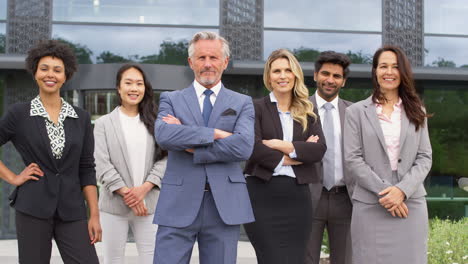 Portrait-Of-Smiling-Multi-Cultural-Business-Team-Outside-Modern-Office-Building