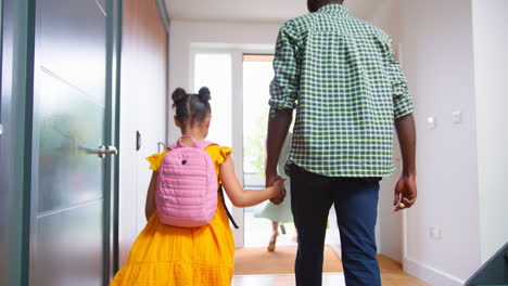 Parents-At-Home-Helping-Children-Get-Ready-And-Leave-As-Family-Go-To-School-Together