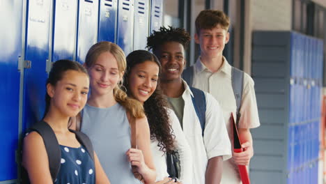 Portrait-Of-Multi-Cultural-High-School-Or-Secondary-Students-Standing-By-Outdoor-Lockers