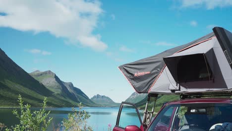 Vehicle-Rooftop-Tent-By-The-Lakeshore-Near-Gryllefjord-Fishing-Village-In-Senja,-Norway