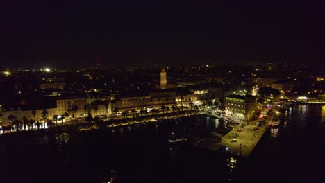 Aerial-night-view-of-Split,-Croatia:-city-lights-and-sprawling-urban-tapestry